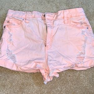 Distressed light pink shorts